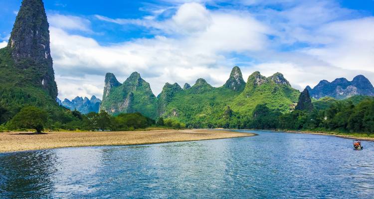 Meandering river surrounded by karst mountains.