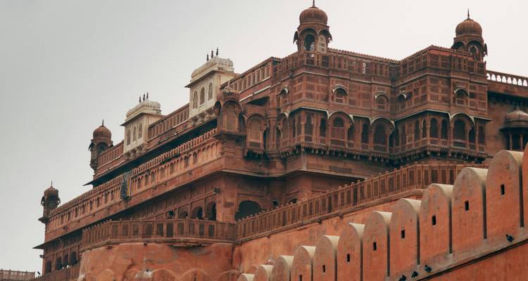 Ornate red fort with intricate architecture.