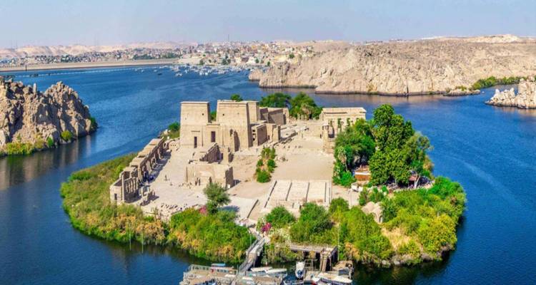 Island with archaeological structures surrounded by water.