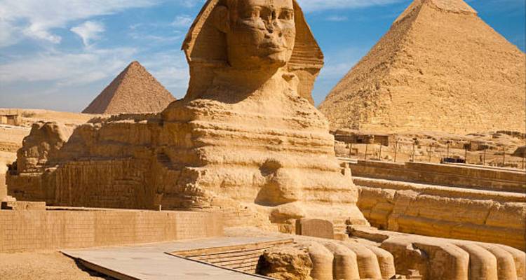 The Sphinx and pyramids in the desert.