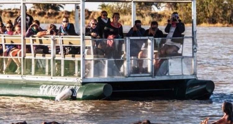 Group of tourists on a boat safari.