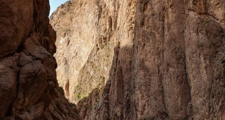 Imposing rocky canyon formations rising steeply.