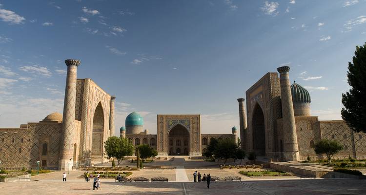 Grand Registan Square in Samarkand with three majestic madrassas and expansive plaza.
