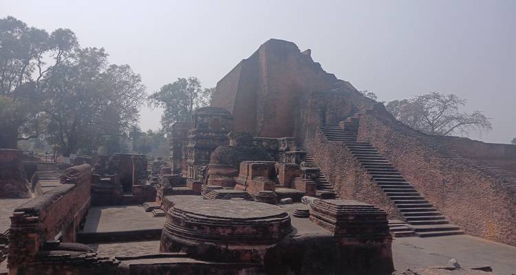 Ancient brick ruins with round and rectangular structures.