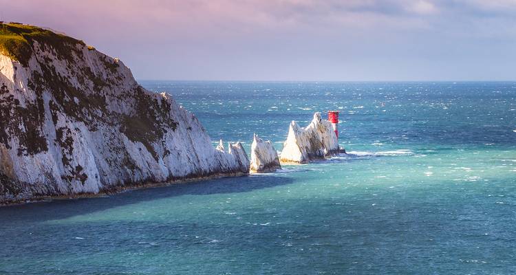 Cliffside view of The Needles with a lighthouse.
