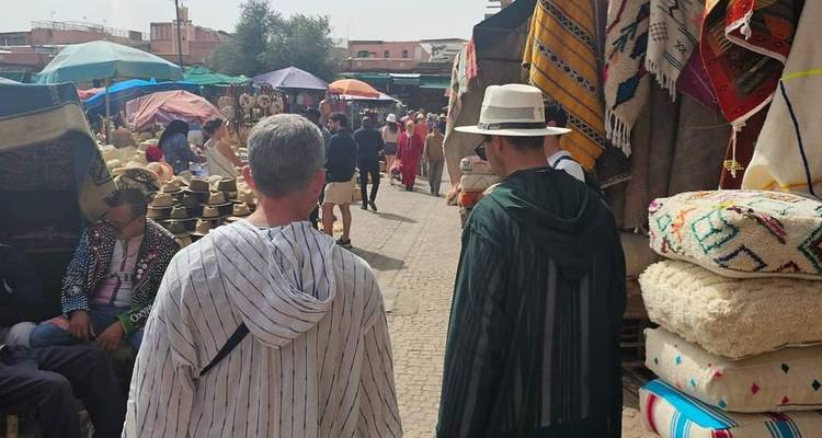 People walking through a busy market street