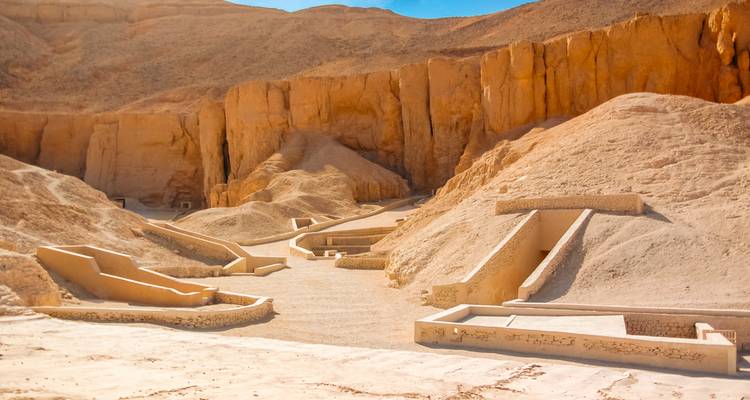 Valley of the Kings entrance with tombs built into cliffs.