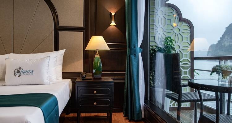 Interior of a cruise cabin with a view of the sea.