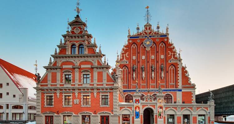 Ornate historical building with intricate detail and blue sky.