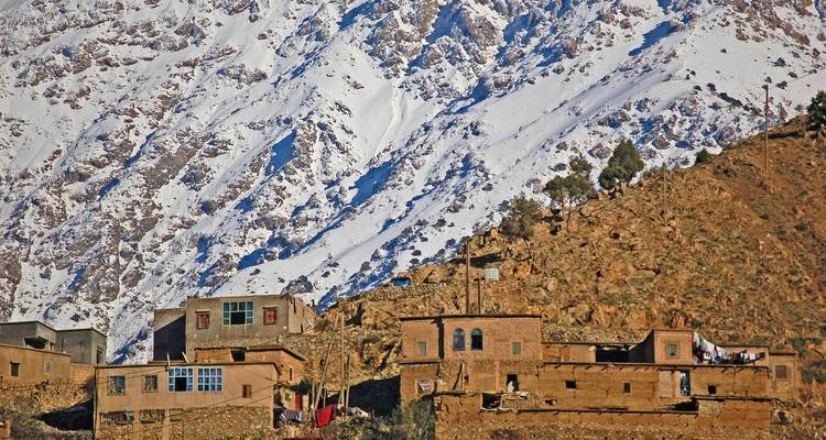 Small village at the foot of snowy mountains.
