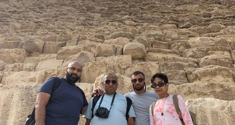 Group standing beside pyramid stones in Giza.