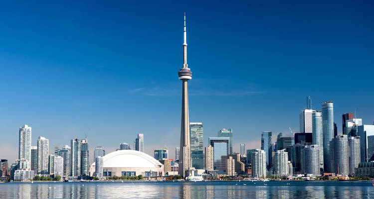 Toronto skyline featuring the CN Tower and waterfront.