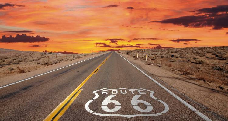 Straight road leading into the horizon with a Route 66 sign.