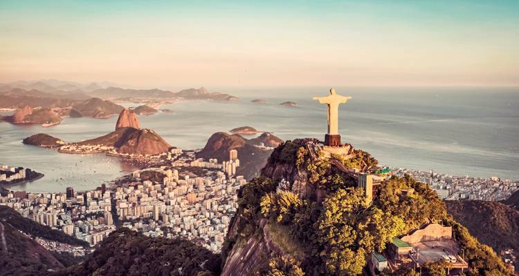Aerial view of Christ the Redeemer statue overlooking Rio de Janeiro.