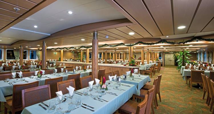 Large dining area with tables set for a meal.