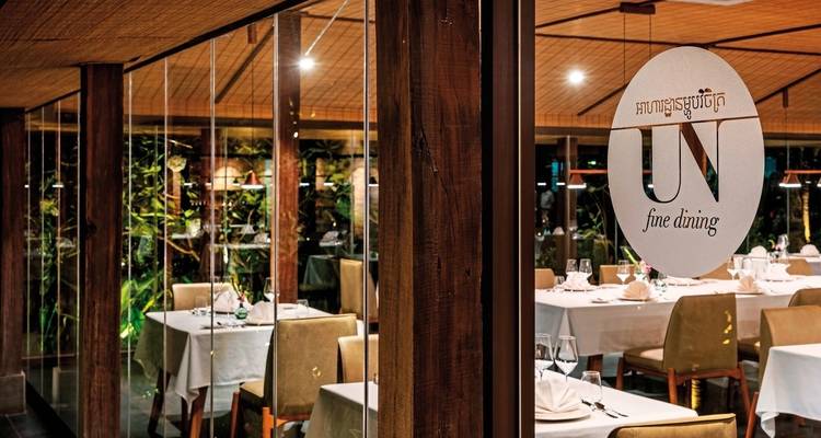 Close-up of fine dining restaurant with a logo on the glass.