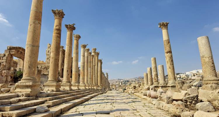 Ancient Roman columns of Jerash under a clear sky.