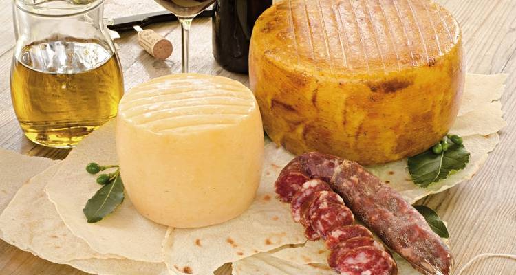 Traditional Sardinian cheese and meat on a table.