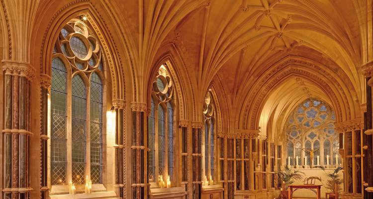 Gothic-style interior of a chapel with stained glass windows.
