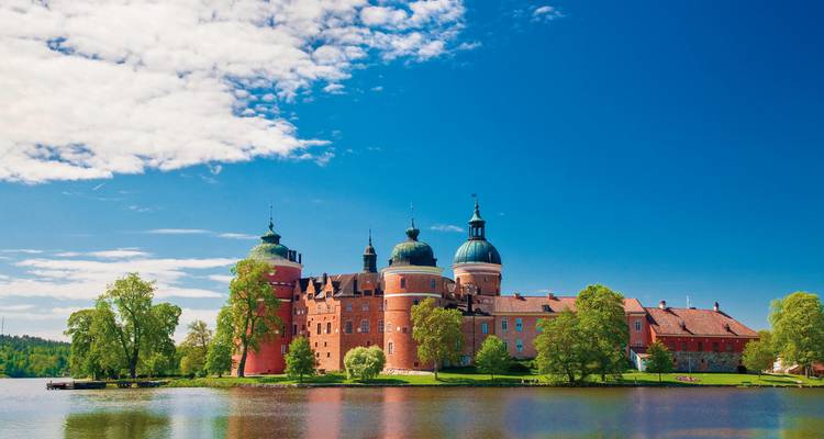 Beautiful castle by the water with blue sky.