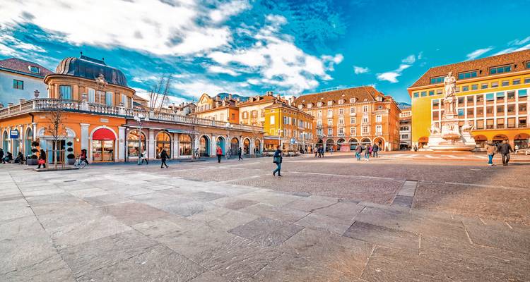 Bustling square with historic buildings, Italy.