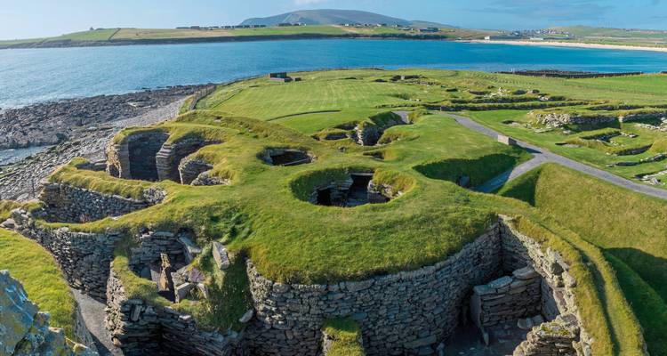 Panoramic view of ancient stone settlement by the sea.