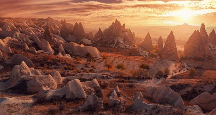 Rock formations and valleys at sunset in Cappadocia.
