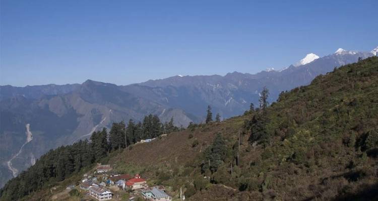Mountain range with a small village in the foreground.