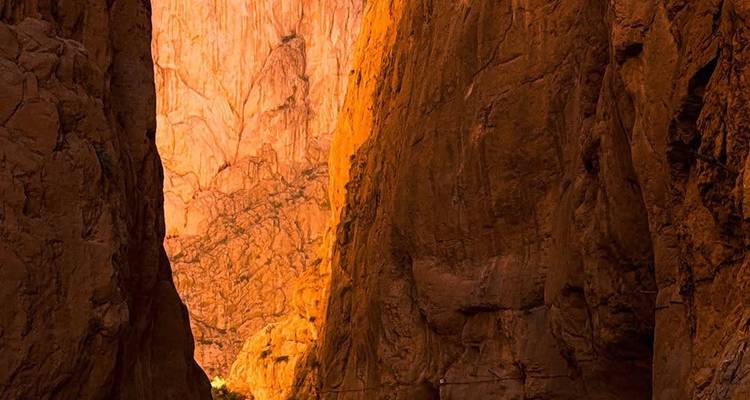 A gorge with steep rocky walls.