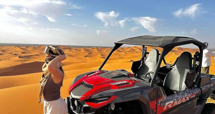Person with an ATV in the desert.