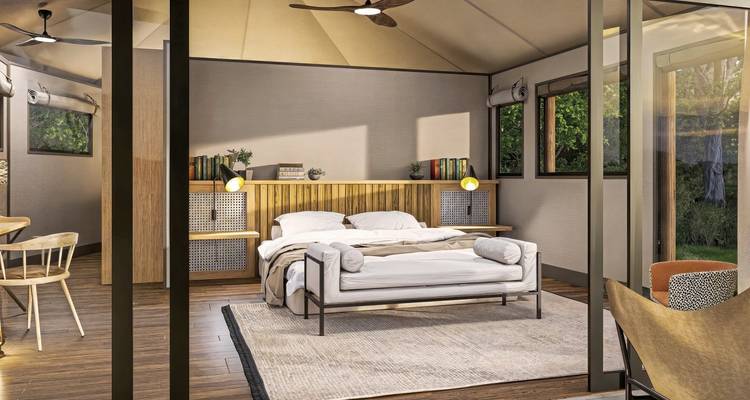 Un intérieur douillet d'un lodge moderne avec un lit et de la décoration.