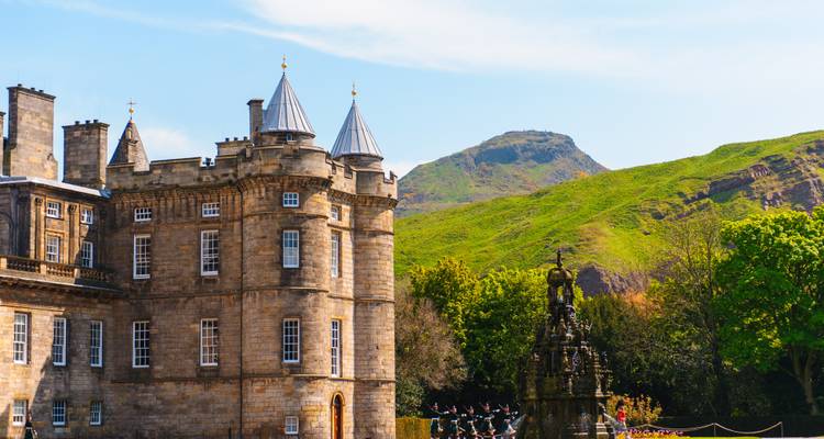 Historic Holyrood Palace framed by Arthur’s Seat and lush gardens in Edinburgh