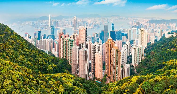 Skyline view of Hong Kong with tall buildings and mountains
