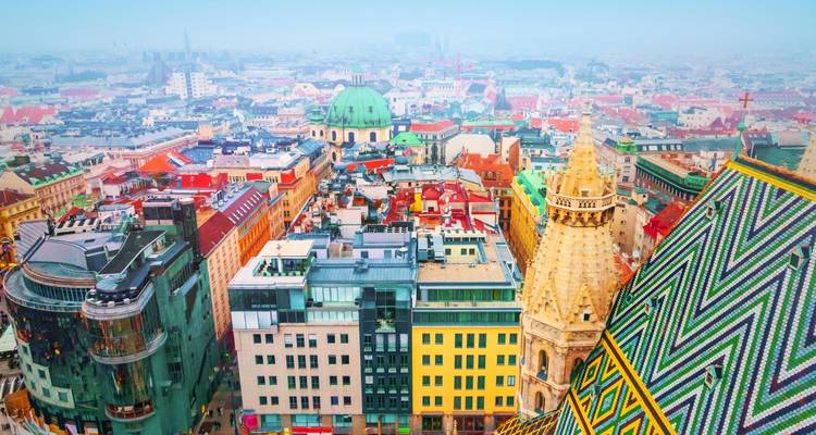 Colorful view of Vienna rooftops from above.
