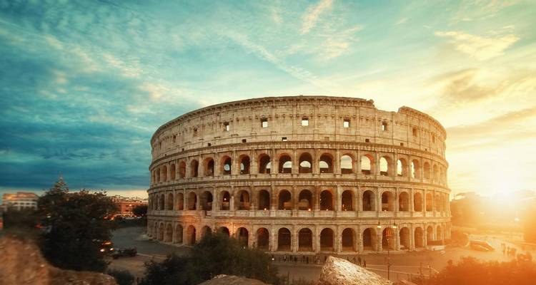 Colosseum in Rome during a dramatic sunset.