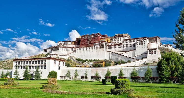 Potala Palace dominates Lhasa’s skyline, its white and maroon tiers gleaming in sunlight.
