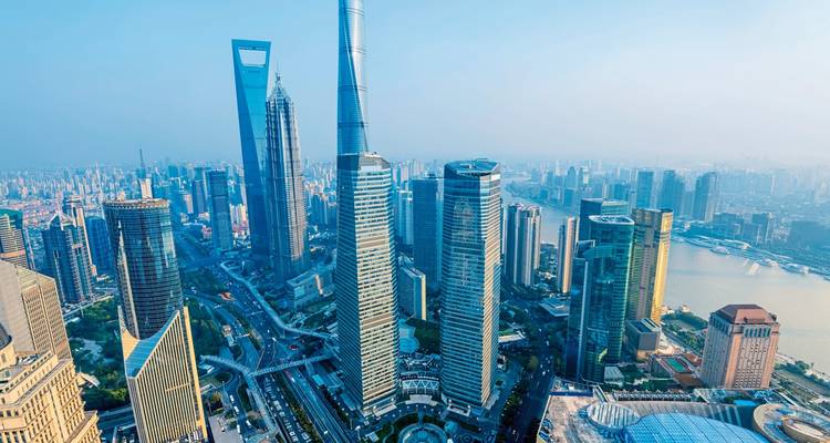Modern cityscape of Shanghai with tall skyscrapers.