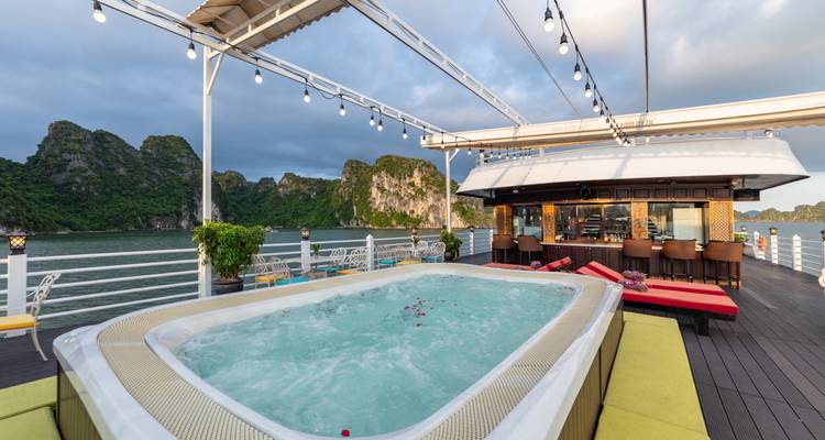 Jacuzzi on a cruise ship deck with panorama of limestone hills