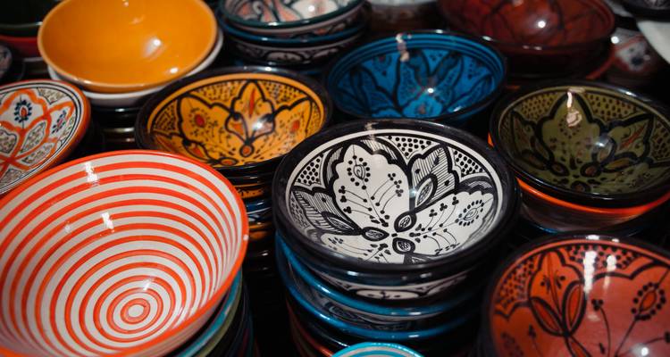 Colorful handmade ceramic bowls on display.