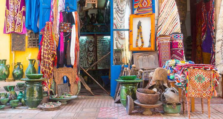 Traditional market with colorful textiles and pottery.
