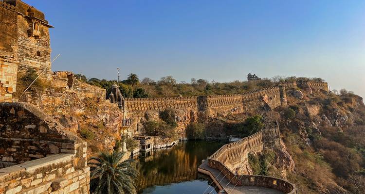 Ancient fort with long stone walls overlooking a serene landscape.