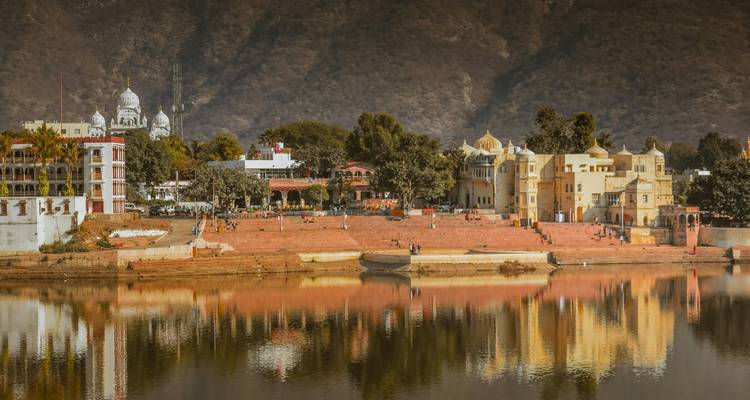 Riverside city with traditional architecture.