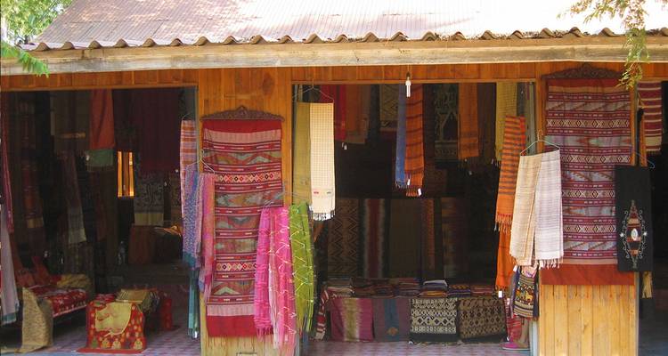 Shop with hanging textiles and woven fabrics.