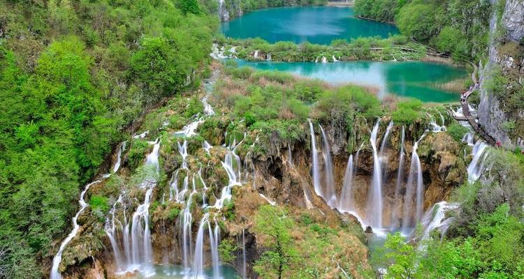 A series of breathtaking waterfalls surrounded by lush greenery.