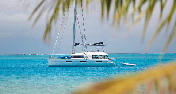 Sailboat stationary in beautiful turquoise waters.