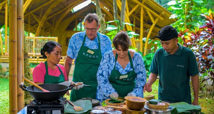 Cooking class with tourists and locals preparing traditional dishes.