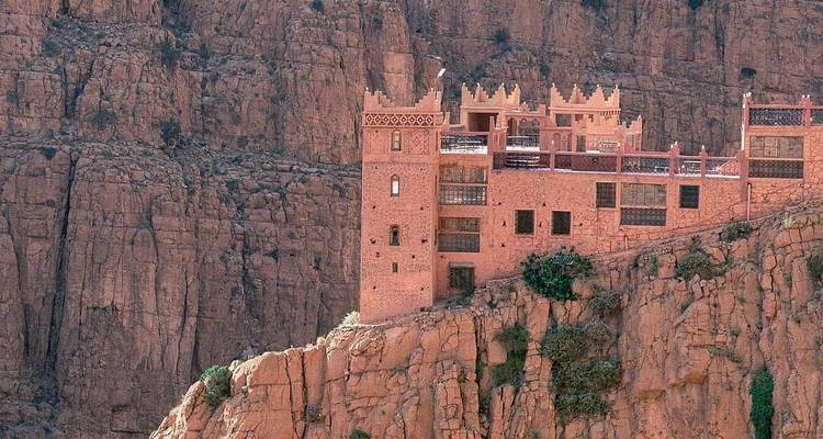 Fortress-like building on a rocky cliff.