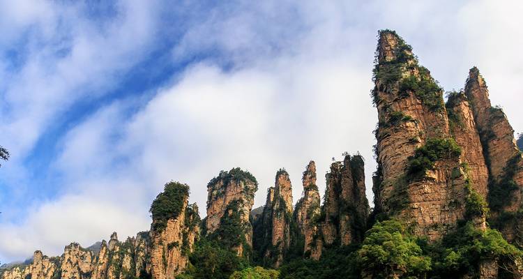 Zhangjiajie rock pillars against a blue sky