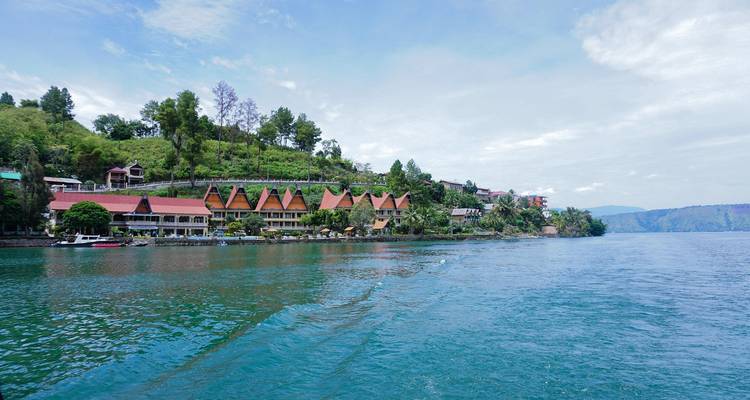 Lake Toba with traditional houses on the shore.