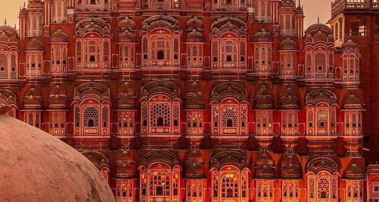 Close view of the intricate pink façade of Hawa Mahal illuminated by warm light.